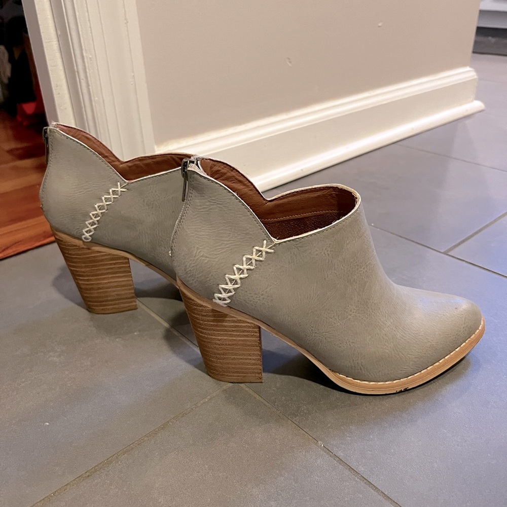 Beautiful faux leather booties with cute side cross stitching.